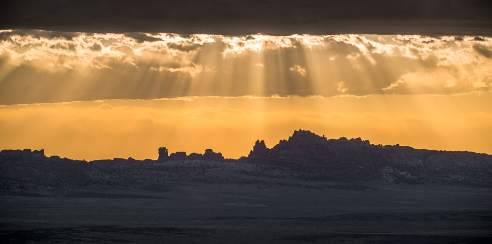 God beams near sunset at Skyline Arch.