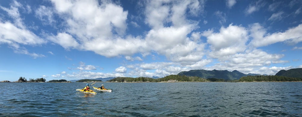Eric and Lynn kayaking on a glorious day near the Bunsby Islands