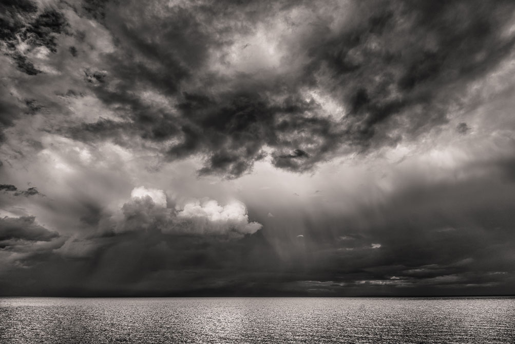 Storm clouds and rain looking east on the Strait of Georgia, BC.